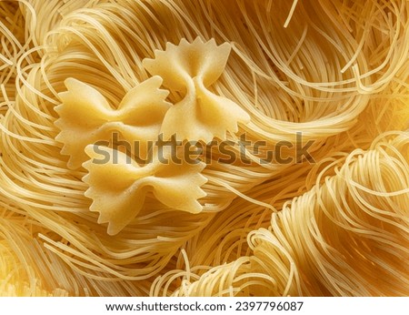 Italian pasta vermicelli and farfalle close-up. Food background.