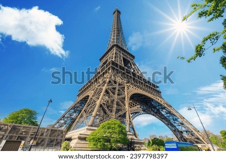 Paris Eiffel Tower and Champ de Mars in Paris, France. Eiffel Tower is one of the most iconic landmarks in Paris. The Champ de Mars is a large public park in Paris
 Royalty-Free Stock Photo #2397798397