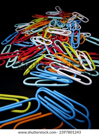 Background image of colorful paper clips graphics for illustrations