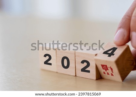 Training and knowledge sharing concept. Workforce and team training plan in 2024.  Wooden cubes with 2024 and training symbols on smart background and copy space. Training program planning by HRM. Royalty-Free Stock Photo #2397815069