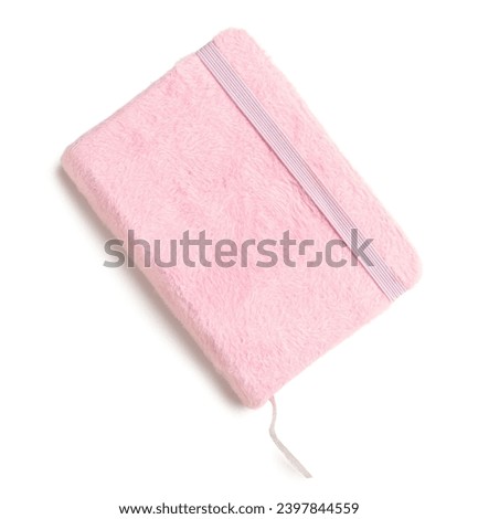Stylish notebook in pink plush cover isolated on white background Royalty-Free Stock Photo #2397844559