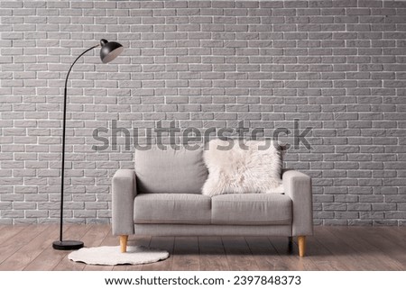 Interior of living room with grey sofa and floor lamp Royalty-Free Stock Photo #2397848373