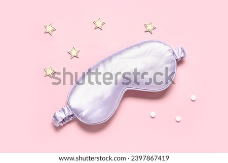 Composition with stylish sleep mask, pills and decor on color background