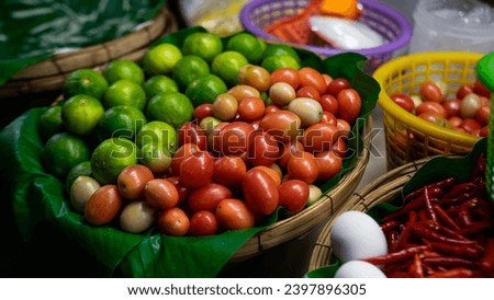 Picture of a Somtam shop at a temple fair. Place for various types of vegetables Placed in a woven bamboo tray, there were red-pink tomatoes and fresh green limes.