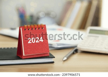 2024 Happy New Year background. 2024 Red calendar on desk. Set up target business and budget planning of the new year concept. year change from 2023 to 2024. Planning business for goal and success. Royalty-Free Stock Photo #2397906571