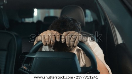 Angry mad aggressive stressed Caucasian businessman feel anger business failure lost male furious man problem despair sit in car automobile salon auto driving trouble driver road accident traffic jam Royalty-Free Stock Photo #2397911241
