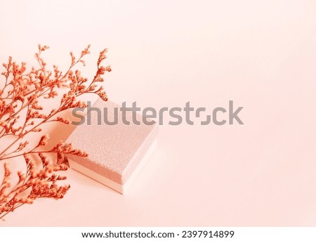 Peach fuzz color Blank greeting card, invitation mockup. Minimal floral frame made of dry flowers and branches. Flat lay, top view.