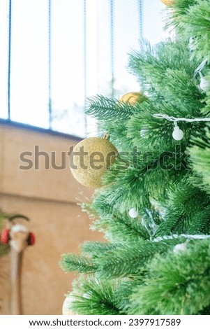 Beautiful gold Christmas ball Decorated on Christmas tree in living room,Festive image in holiday,Merry Christmas and Happy New Year.