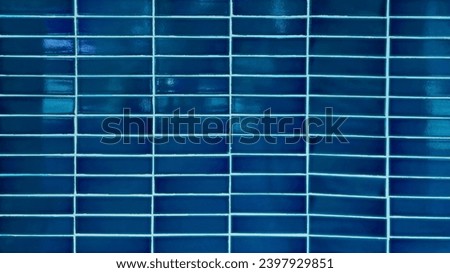 close up blue mosaic wall tiles in modern style. real antique ceramic interior wall tiles. wall tiles background for modern, simple, bold, fresh, soft, antique concept. Royalty-Free Stock Photo #2397929851