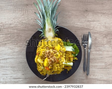 Delicious Fried Rice Served in Pineapple, Perfectly Decorating a Thai Feast