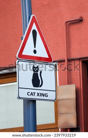 Caution cat crossing xing the road sign. Cat X-ing yield sign featuring a cat.