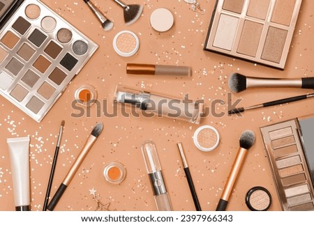 Flat lay of Makeup cosmetic product on pink background. New trending PANTONE 13-1023 Peach Fuzz colour of 2024 year 