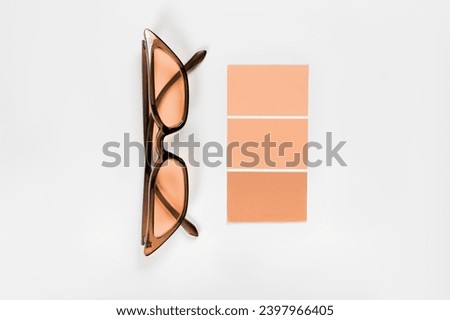  samples palette design catalog with glasses. New trending PANTONE 13-1023 Peach Fuzz colour of 2024 year 