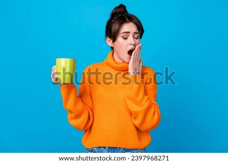 Photo of pretty tired lady wear knitted pullover drinking coffee yawning hand arm cover close mouth isolated blue color background