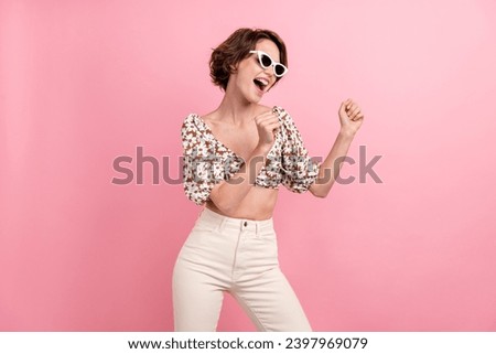 Photo of carefree cheerful person rejoice dancing partying free time weekend isolated on pink color background