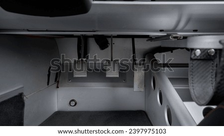 Pedals inside of a sports car Royalty-Free Stock Photo #2397975103