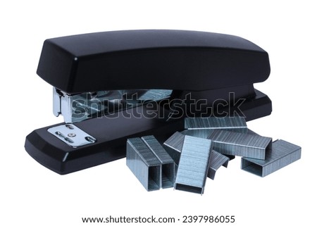 Black professional stapler with a stack of metal staples isolated on a white. Clipping path. Office supplies, stationery, sharpener and others. Office equipment. Macro.
