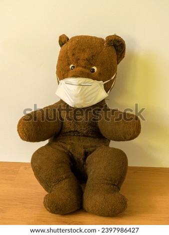picture with old teddy bear, face mask