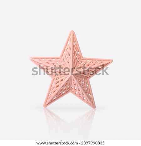 Christmas star in the color of the year "Peach Fuzz" on a white background.