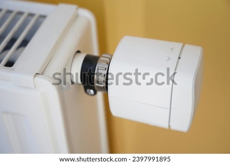 A single white thermostat head sensor working on the smartphone application on the grey background in house Thermostat, White, Sensor, Smartphone, Application, Grey background, House, Technology Smart Royalty-Free Stock Photo #2397991895