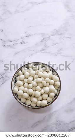 indonesian traditional peanut snack, kacang atom, brightmood concept, flat lay photography 

