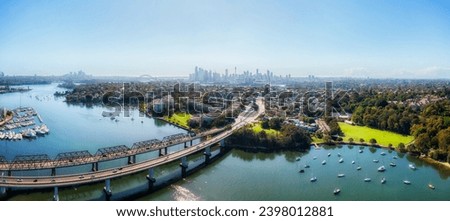Iron Cove bridge and Victoria road motorway at Rozell interchange in Inner West suburbs of Sydney - aerial panorama. Royalty-Free Stock Photo #2398012881