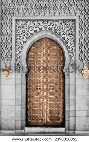 Arabic oriental styled door in Morocco. New trending PANTONE 13-1023 Peach Fuzz colour of 2024 year 