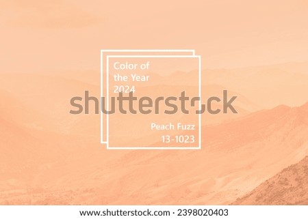 Beautiful sunny day in mountain valley and mountainous countryside landscape in summer toned in pantone color of year 2024 Peach Fuzz Royalty-Free Stock Photo #2398020403