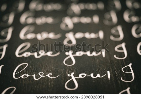 I love you photo illustration of just those words in different colors with bokeh and blur when the focus is not on love. 