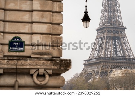 The Eiffel Tower at the foot of the Bir Hakeim bridge in autumn - Paris