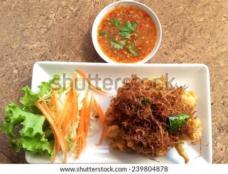 Fried fish with herbs, food thai style of Thailand