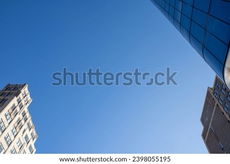 blue sky with office buildings Royalty-Free Stock Photo #2398055195