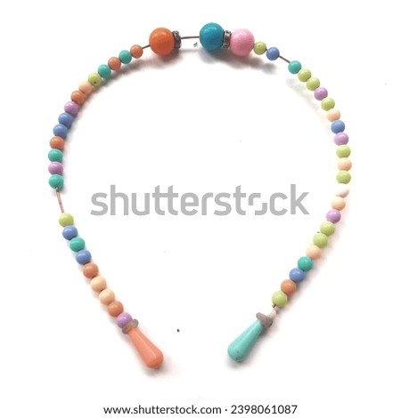 Colorful beaded headband on a white background