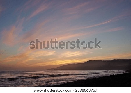 El Capitan State Beach sunset with cloudy and colorful scene Royalty-Free Stock Photo #2398063767
