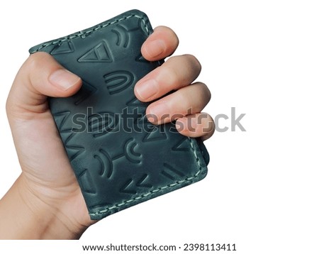 a woman's hand is holding black lether wallet, photo taken with white solated backgrund, easy to use and editable for project, design, banner, adversting, presentation and many more