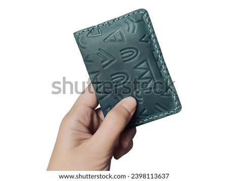 a woman's hand is holding black leather wallet, photo taken with white solated backgrund, easy to use and editable for project, design, banner, adversting, presentation and many more