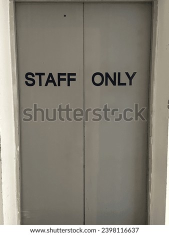 Elevator door background staff only sign