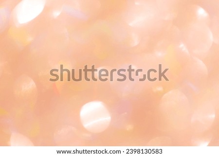 Abstract bokeh background peach colored, natural flare from lights, trend color year 2024 peach fuzz monochrome photo with optical effect, blurred round bokeh texture as holiday backdrop, wallpaper