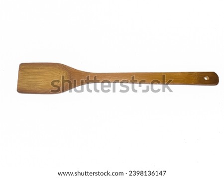 Traditional wooden kitchen utensil wooden spatula isolated on white background. Royalty-Free Stock Photo #2398136147