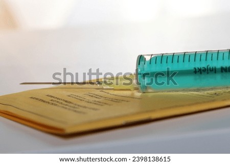 Symbol picture vaccine with vaccination card and syringe