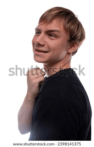 Satisfied European teenage guy with brown hair on a white background