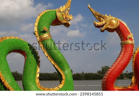Chinese green and red dragons statues