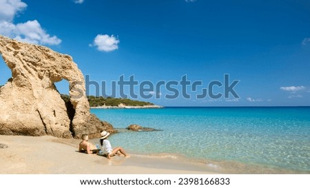 Voulisma Beach Istron Crete Greece, beautiful beaches of Crete island Istron Bay near Agios Nikolaos. A young couple on vacation in Greece Crete during the summer holidays vacation Royalty-Free Stock Photo #2398166833