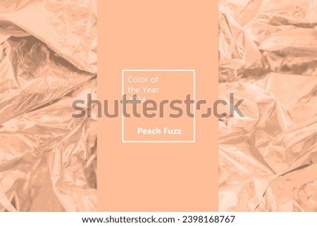 Trendy Color of the Year 2024 peach fuzz. Orange foil texture background. Holographic wrinkled surface. Fashion glittery textile Royalty-Free Stock Photo #2398168767