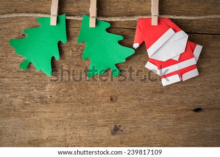 Santa claus paper craft on wooden background