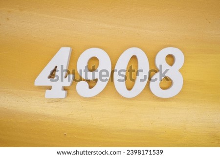 The golden yellow painted wood panel for the background, number 4908, is made from white painted wood.