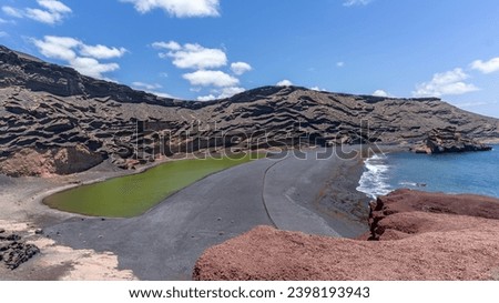 The Green Lagoon Lake in Lanzarote, Canary Islands, El Golfo, Charco de los Clicos, Montana del Golfo, Lago Verde Royalty-Free Stock Photo #2398193943