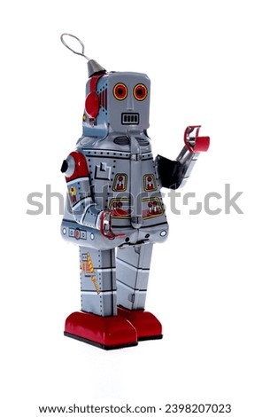 Retro robot toy on white background.
