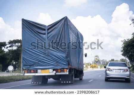 Truck on highway road, sky background, cargo transportation concept.