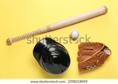 Baseball glove, bat, ball and batting helmet on yellow background, flat lay Royalty-Free Stock Photo #2398218059